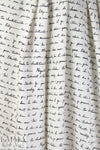 Italian black on cream french script silk charmeuse .95 yds