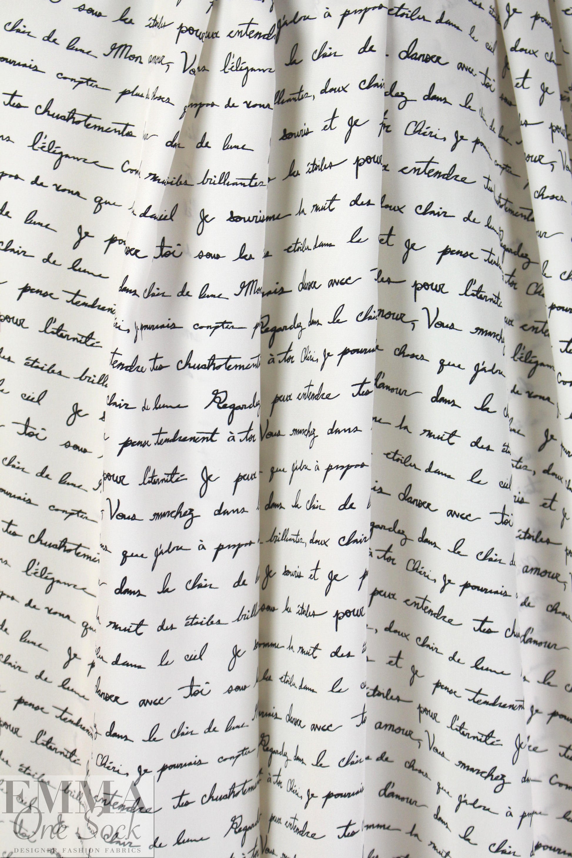Italian black on cream french script silk charmeuse .95 yds
