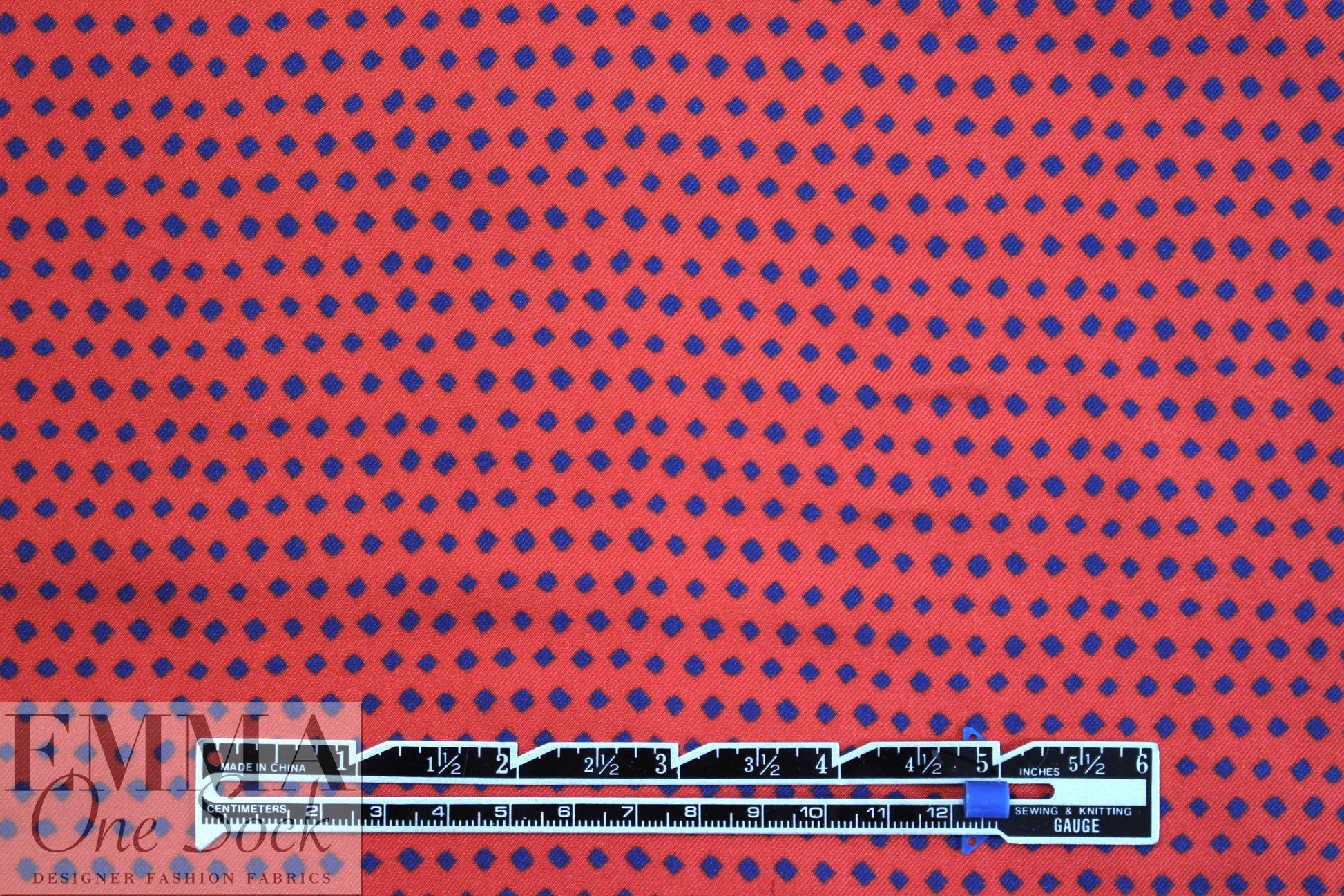 famous designer navy diamonds on red silk twill
