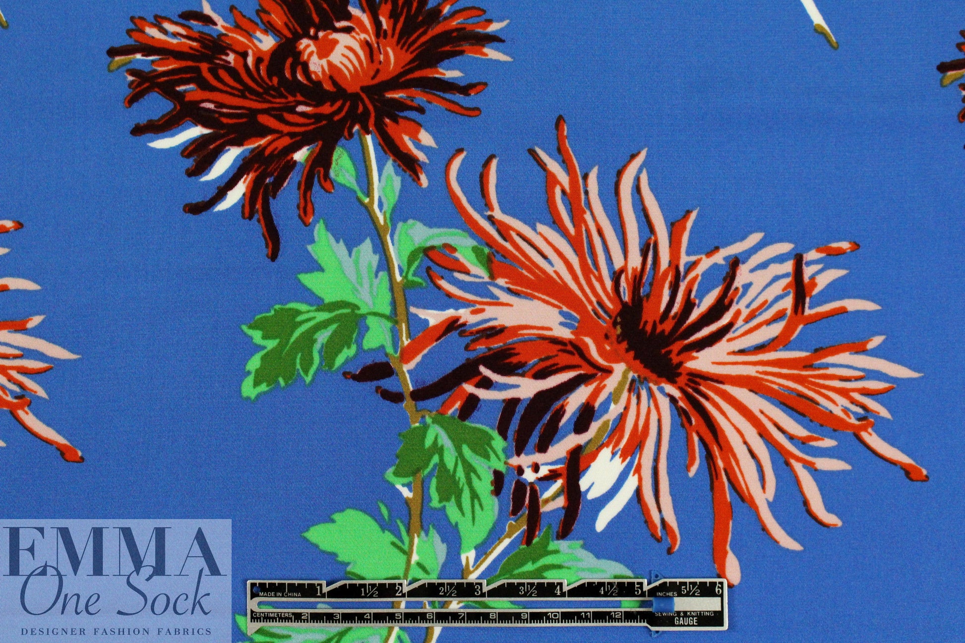 famous designer flower on blue silk stretch woven