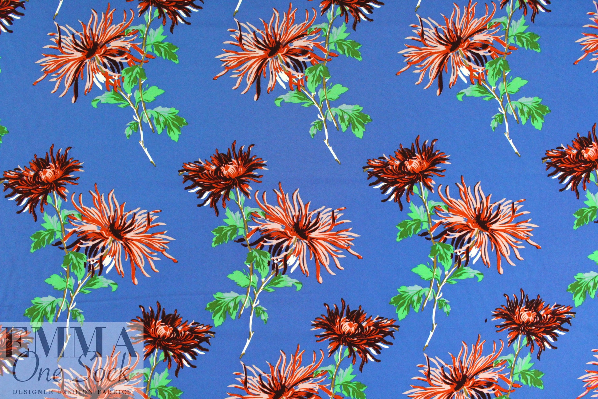 famous designer flower on blue silk stretch woven