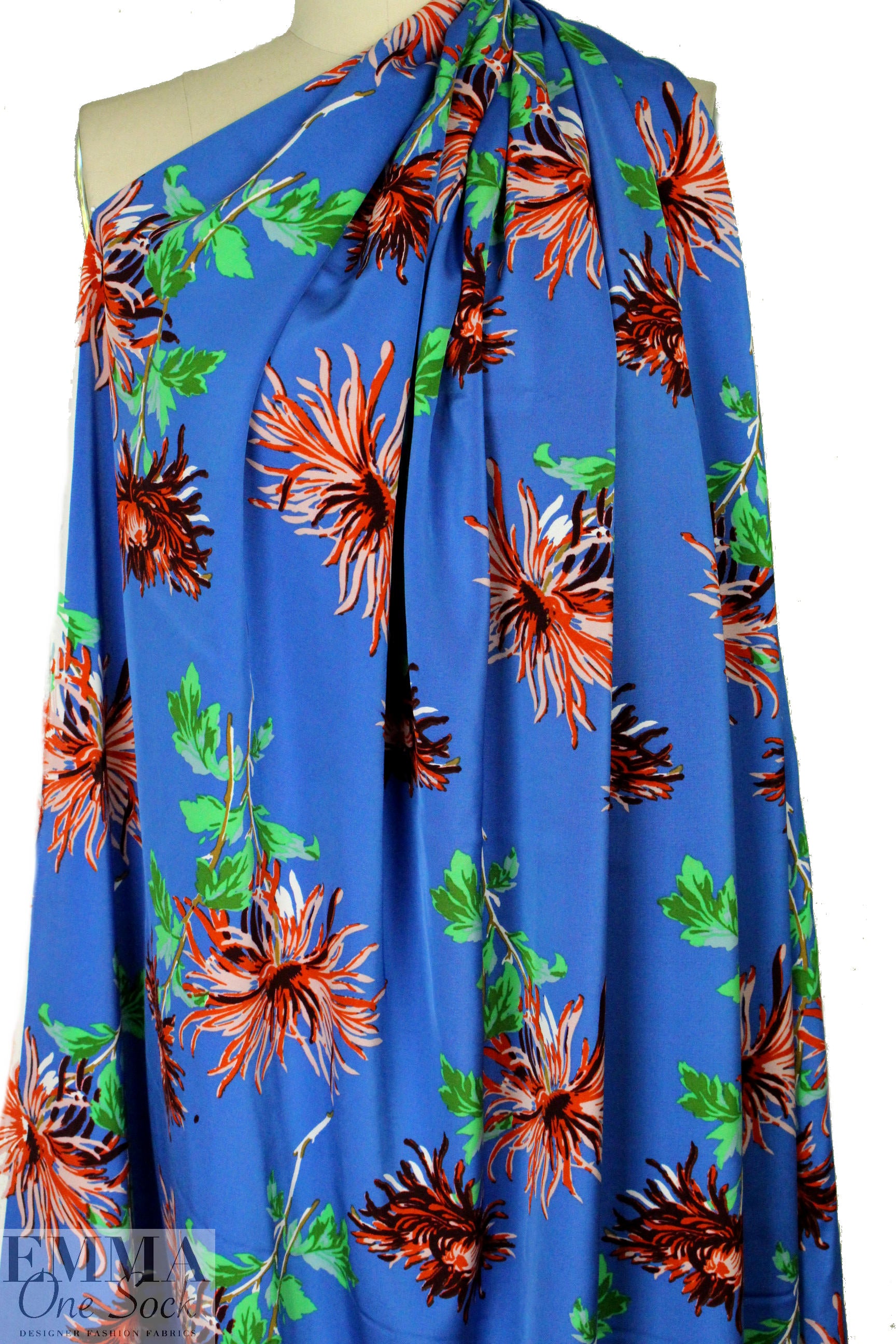 famous designer flower on blue silk stretch woven