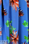 famous designer flower on blue silk stretch woven