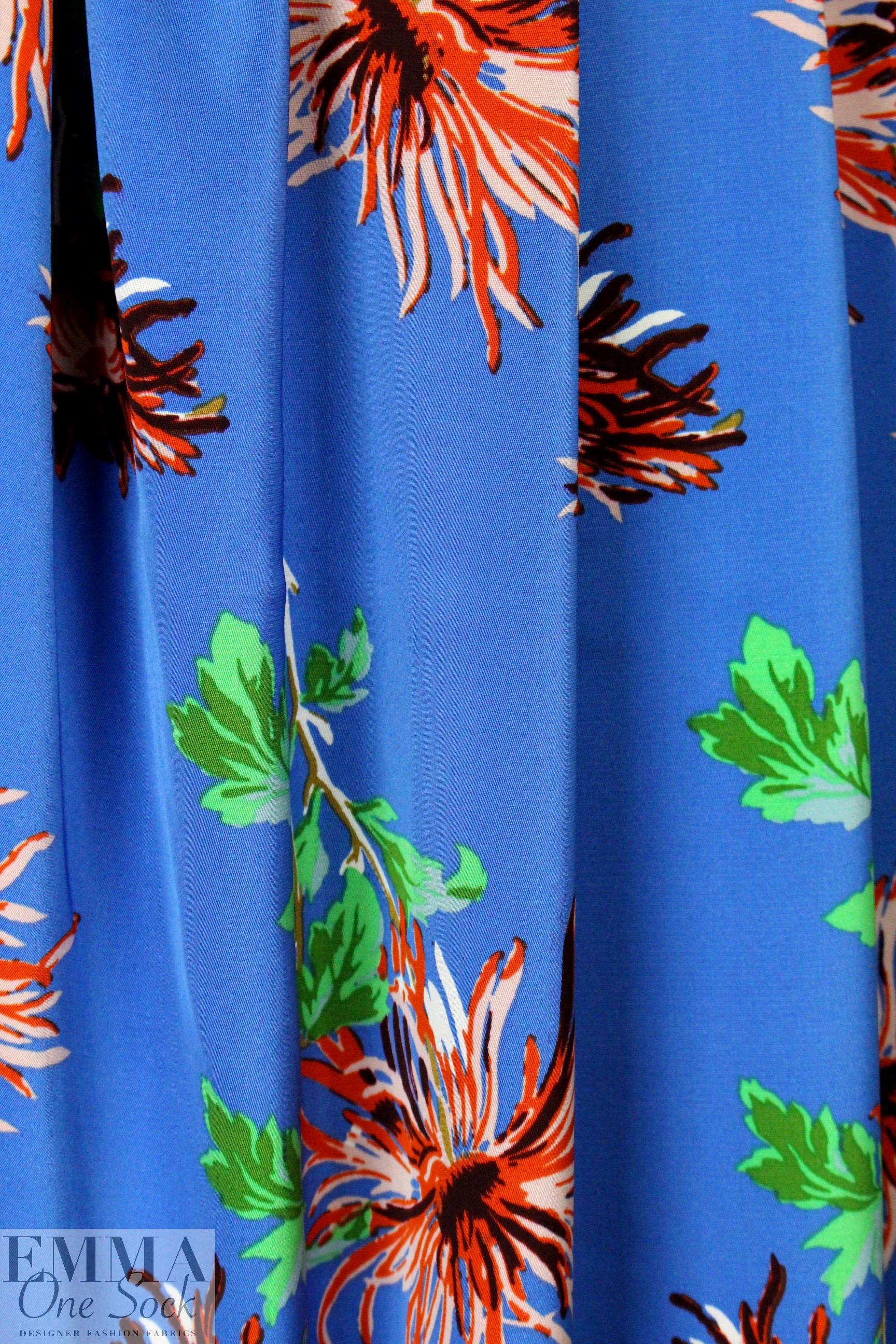 famous designer flower on blue silk stretch woven