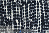 Italian waffle-textured stretch woven - cellular graphic .75 yds