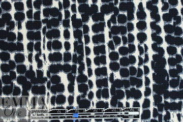 Italian waffle-textured stretch woven - cellular graphic .75 yds