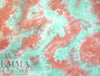 NY designer tie dye poly knit - coral/jade .75 yds