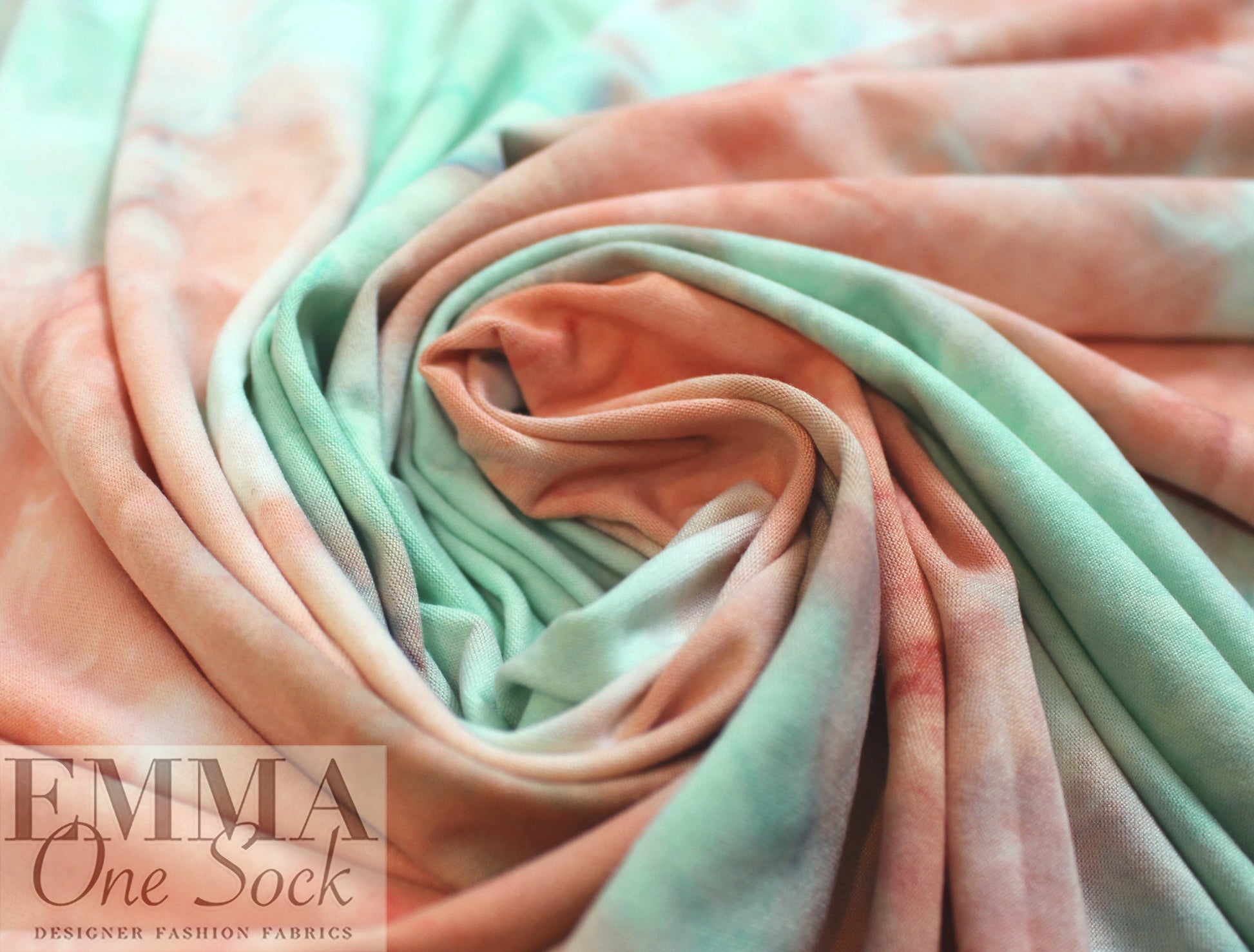NY designer tie dye poly knit - coral/jade .75 yds