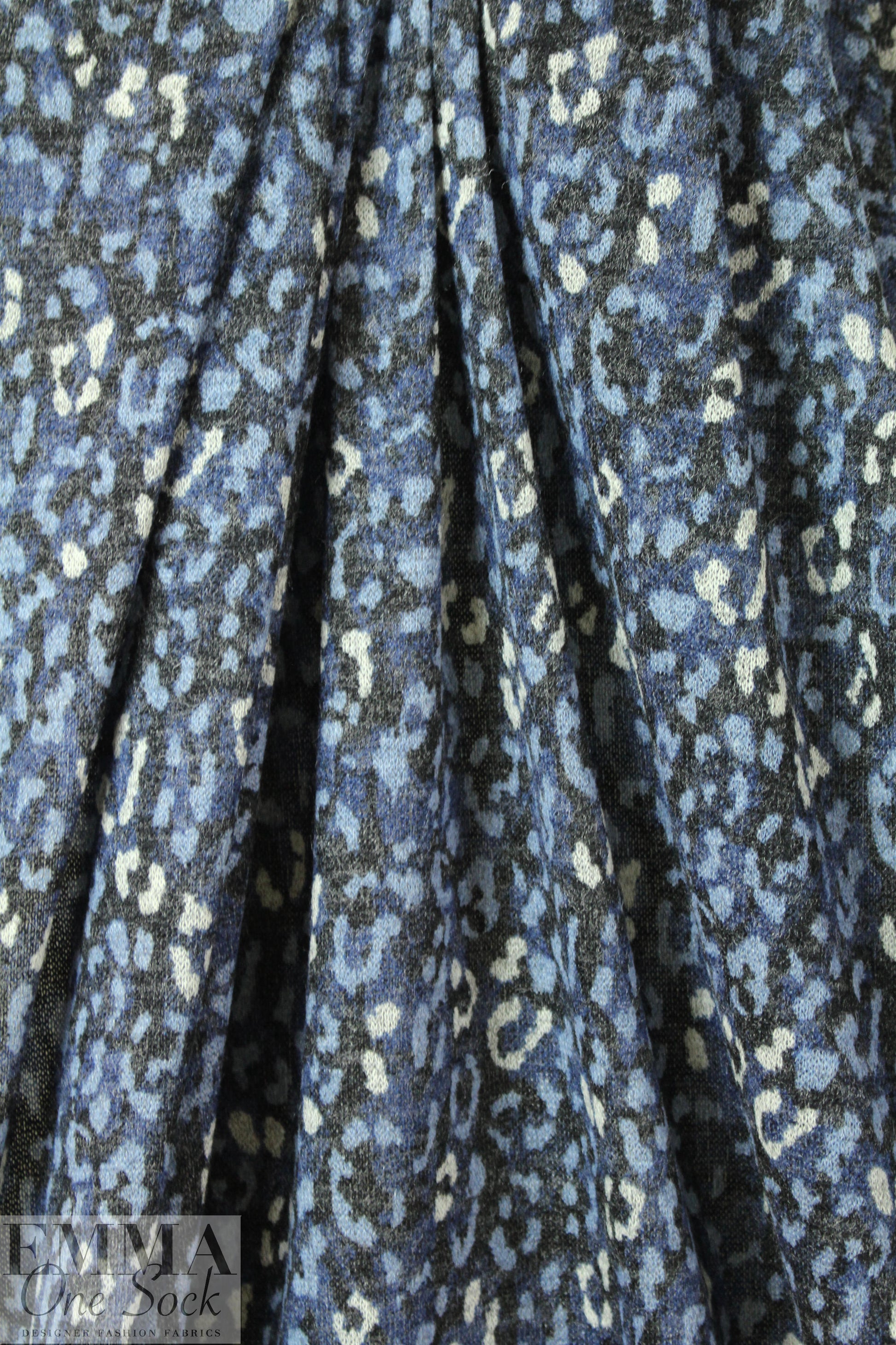 heathered, printed sweater knit - spotted denim .66 yds