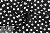 Italian white on black dot drapey viscose woven