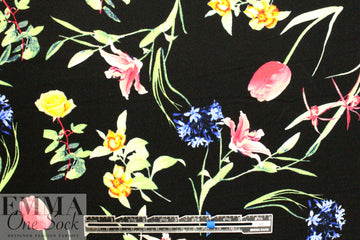 spring flowers on black drapey viscose woven