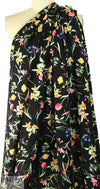 spring flowers on black drapey viscose woven