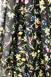 spring flowers on black drapey viscose woven