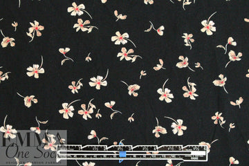 falling blossoms on black drapey rayon woven 1.25 yds