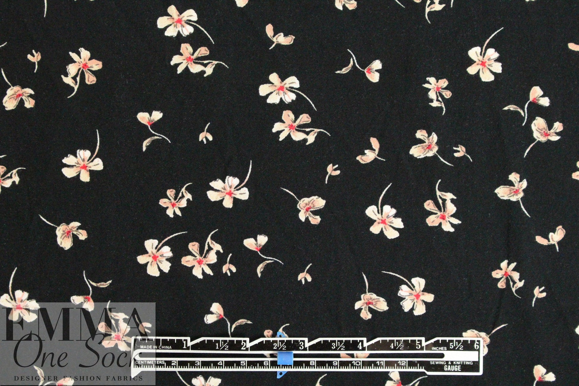 falling blossoms on black drapey rayon woven .75 yds