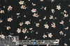falling blossoms on black drapey rayon woven 3 yd