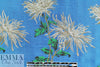 famous designer flowers on blue viscose brocade
