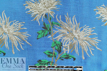 famous designer flowers on blue viscose brocade