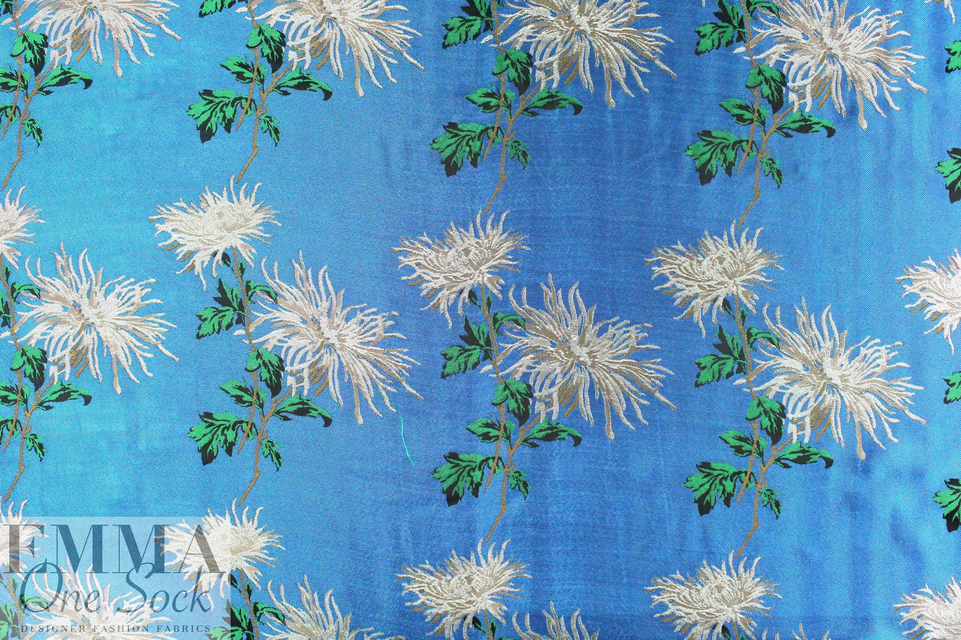 famous designer flowers on blue viscose brocade