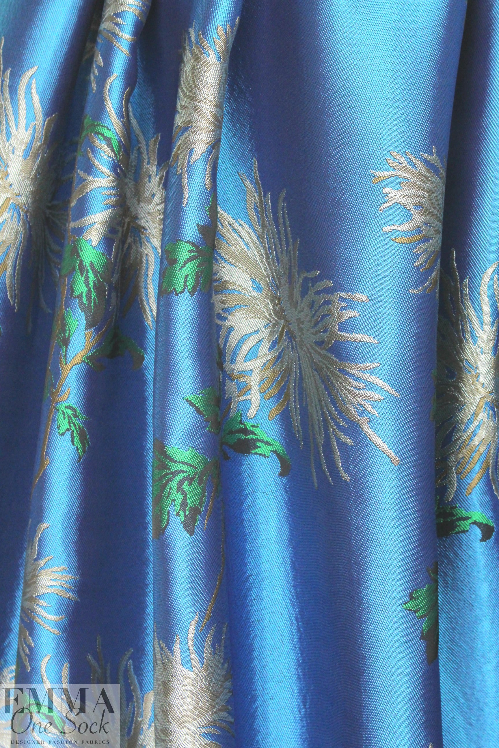 famous designer flowers on blue viscose brocade