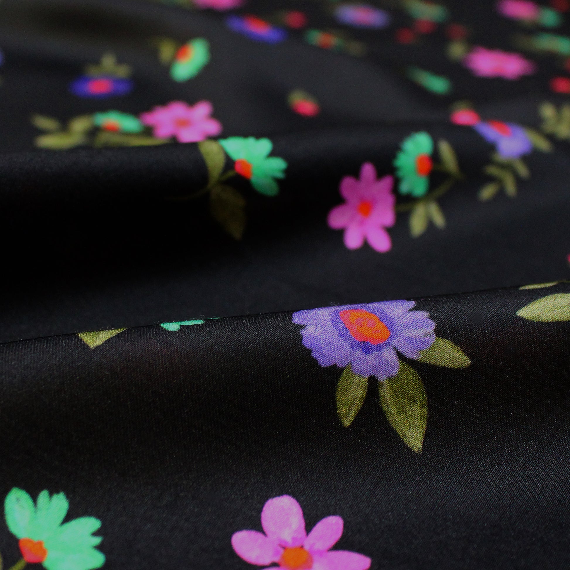 Italian 'painted blooms on black' viscose charmeuse