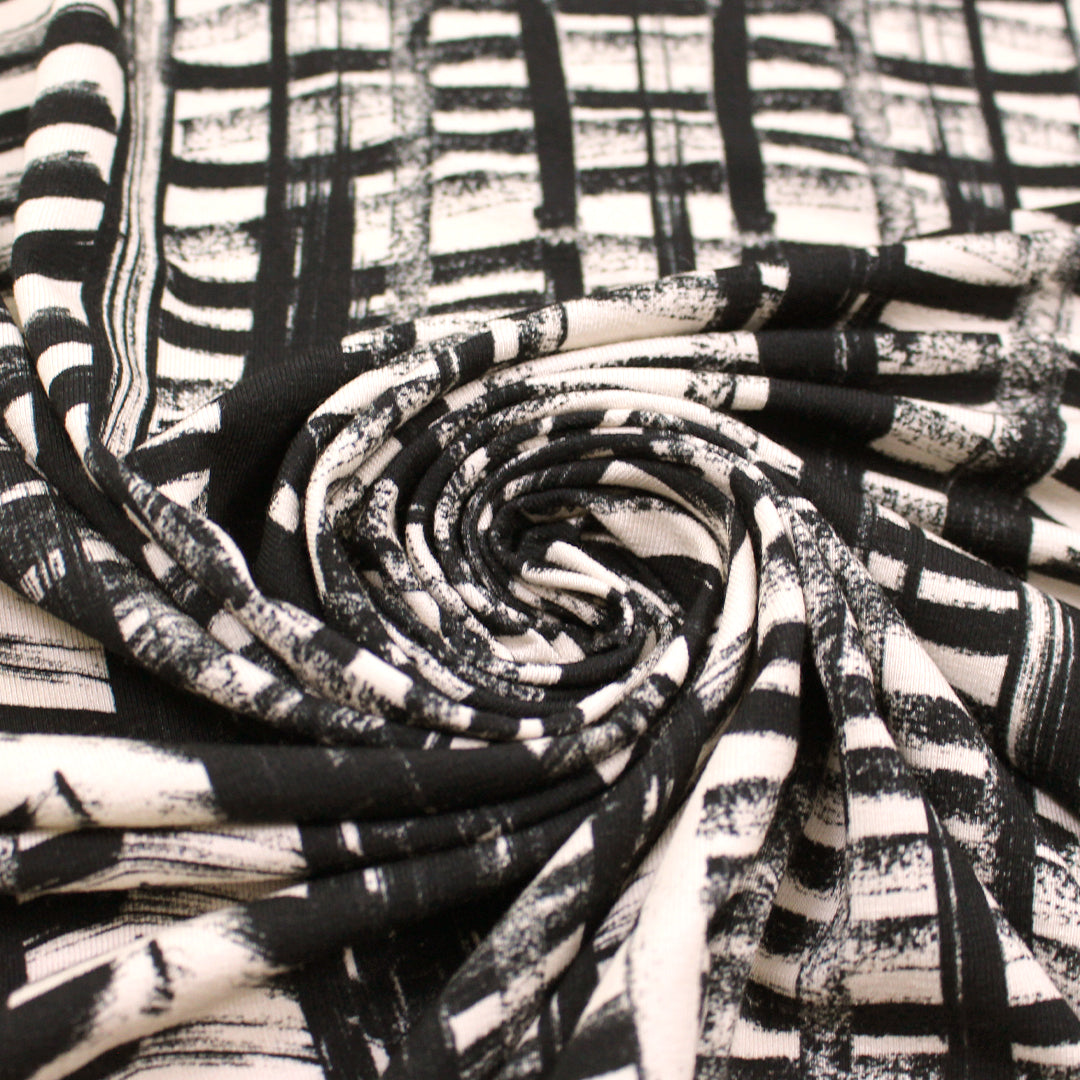 'edgy brushstrokes' stretch viscose knit - black/ecru 1.25 yds