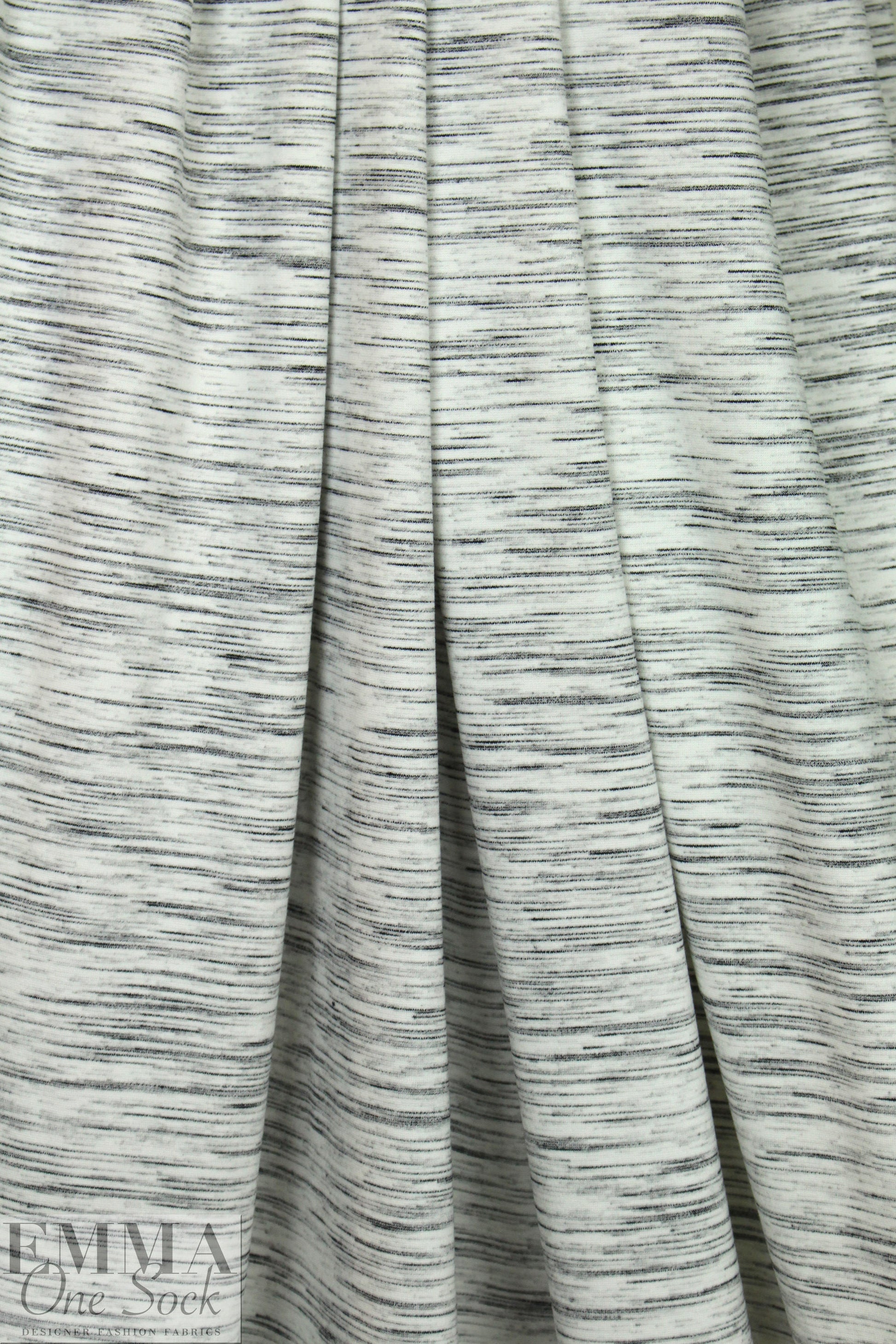 CA designer space dyed ponte - black on creamy white